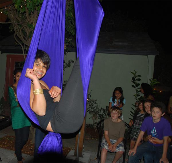 Junior Sama Rao swings from a silk. Photo Courtesy of Sama Rao.