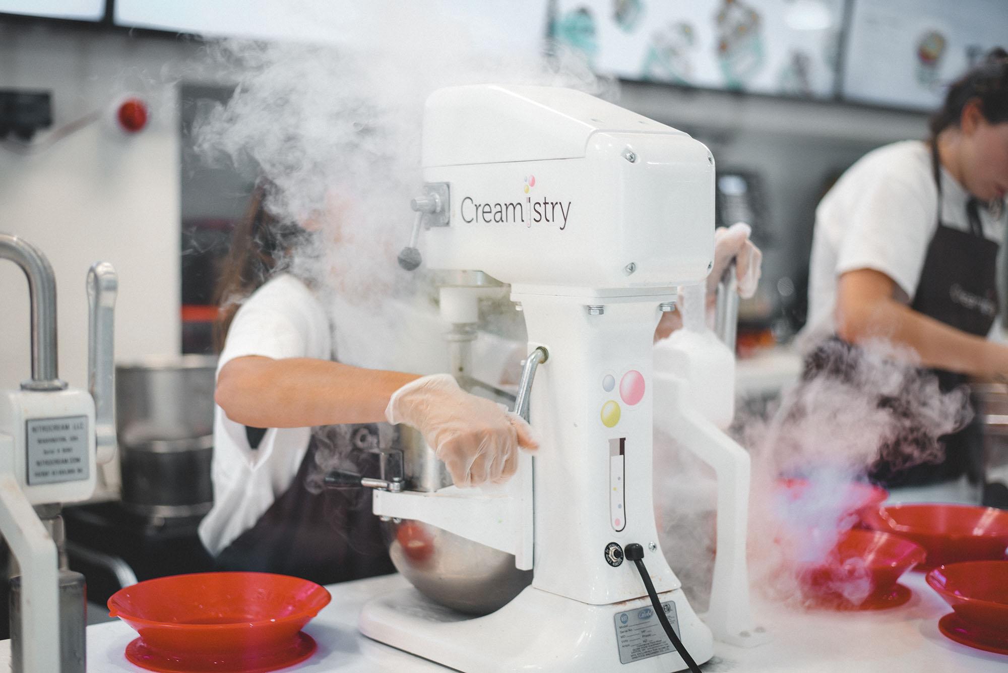 Clouds+of+liquid+nitrogen+are+created+by+a+Creamistry+employee+making+a+serving+of+ice+cream