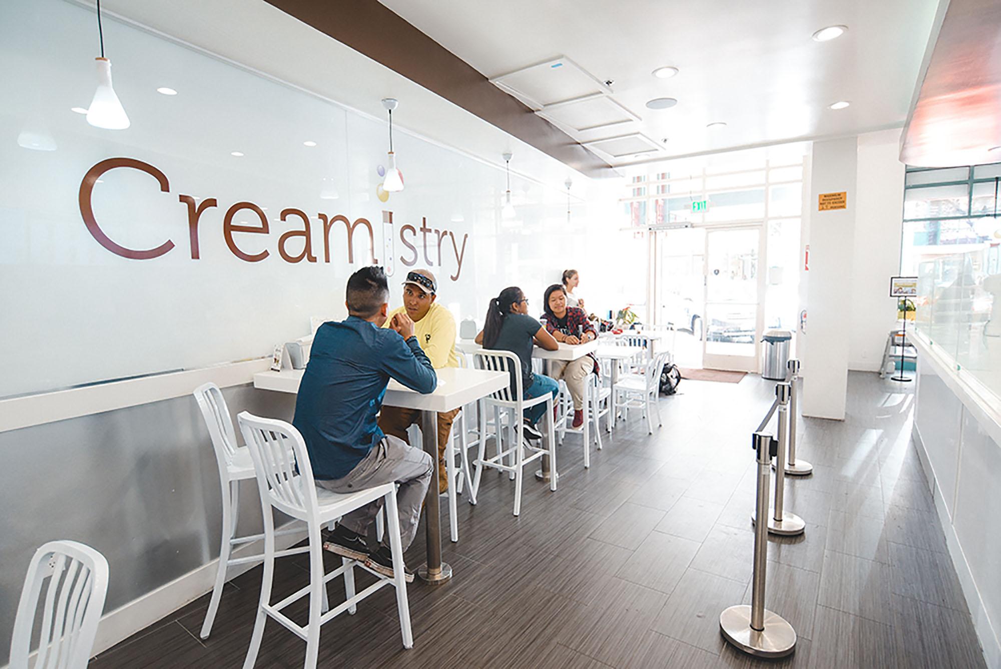 Customers enjoy their ice cream inside the Creamistry storefront