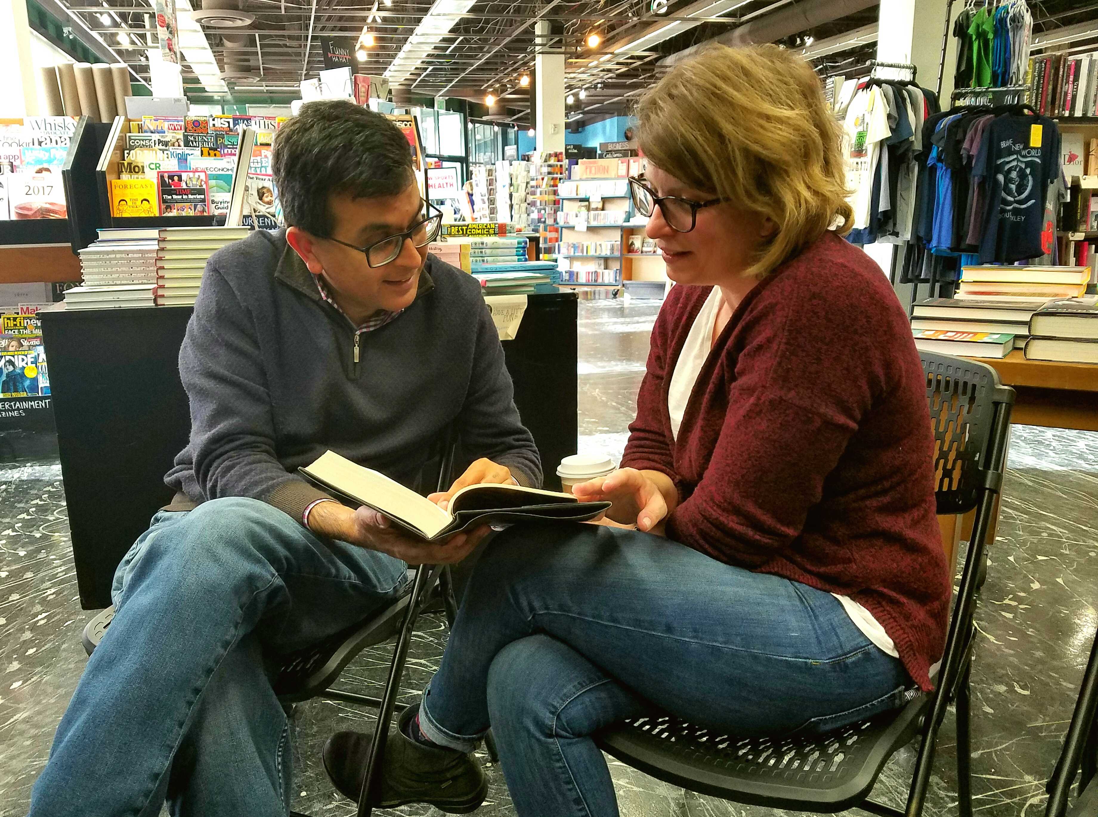 Kepler’s CEO Praveen Madan and Manager 
Amanda Hall pore through one of the newest teen novels. Photo By Emma Cockerell