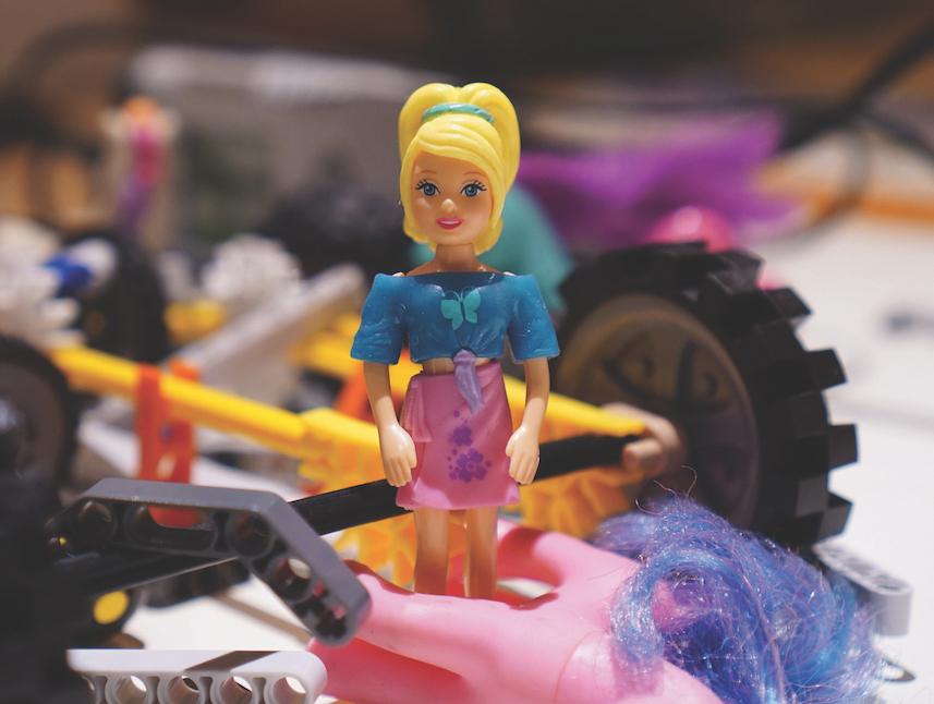 This photo illustration juxtaposes toys traditionally given to boys with those traditionally given to girls to demonstrate the different influences on each gender.