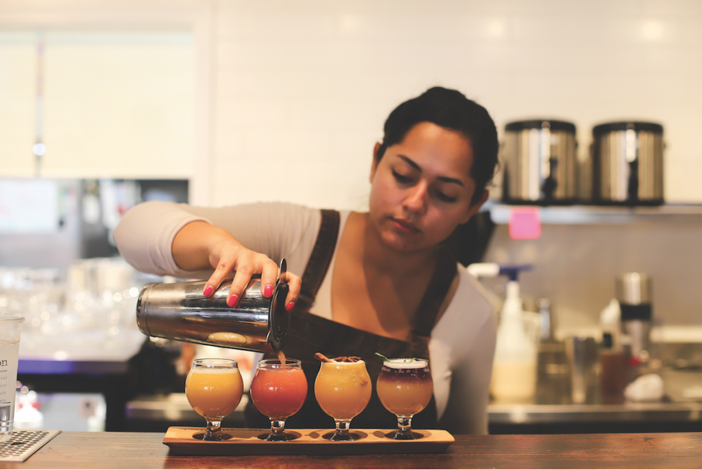 Teaquation & Tonic employee Daisy serves an assortment of beverages available at the restaurant. 