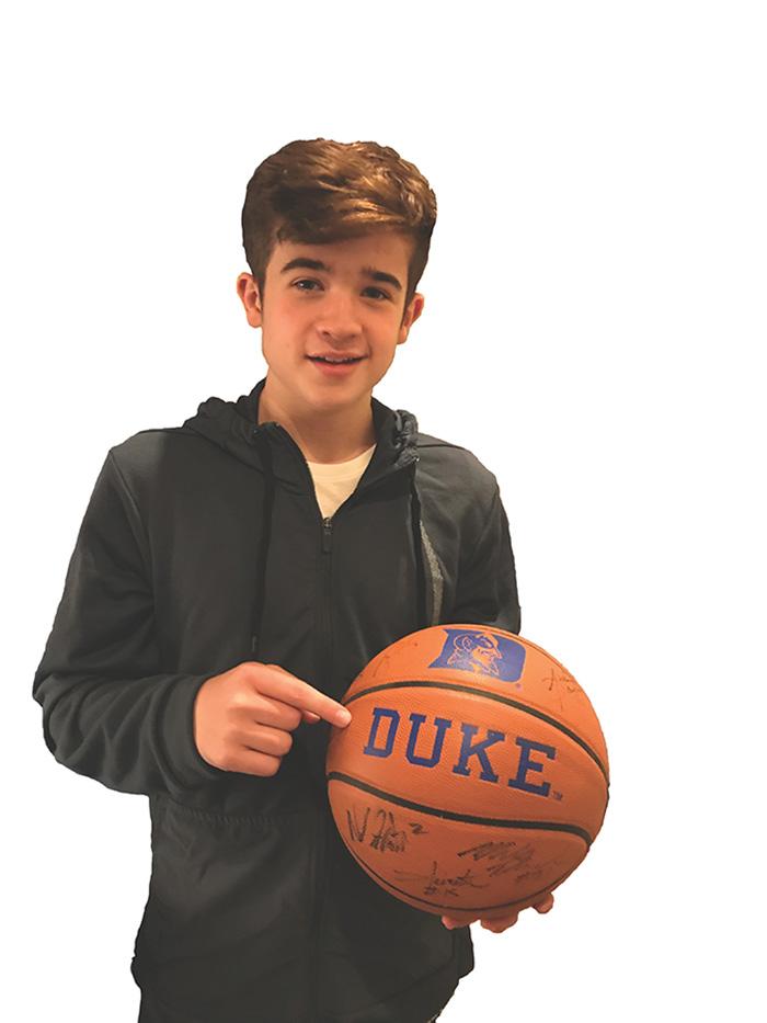 Max Bonnstetter holds up a ball signed by the Duke basketball team Every year Ive done March Madness and Ive done one or two rounds for NCAA and Sports Illustrated.