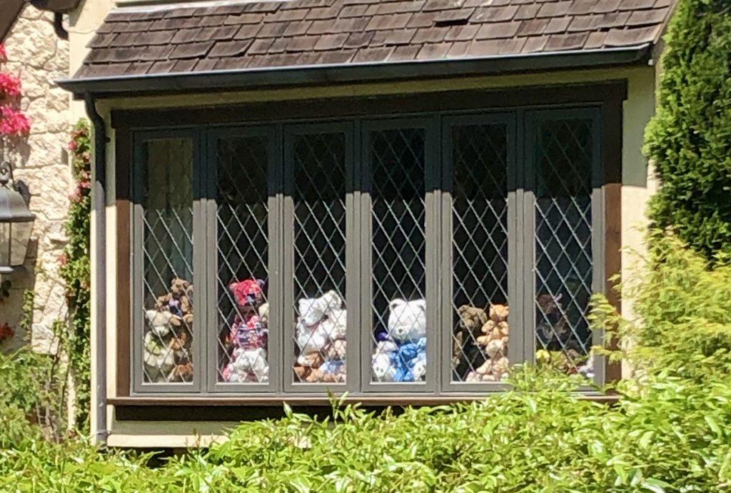 BEARS IN A ROW — Teddy bears have been cropping up in windows around the world, as a kind of scavenger hunt for younger children. “We kept count of how many we spotted and it was good to see new ones on our walks – kind of like a scavenger hunt,” Harris said. Photo by Jay Renaker