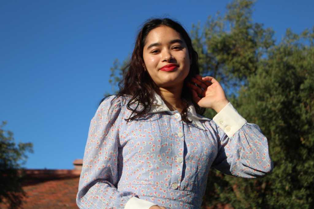 PROLIFIC POET — Senior Jasmine Kapadia poses with a smile. As an Asian American, Kapadia’s cultural identity is a central part of her poetry. “For me, poetry has always been about finding my voice,” Kapadia said. Photo: Ines Legrand