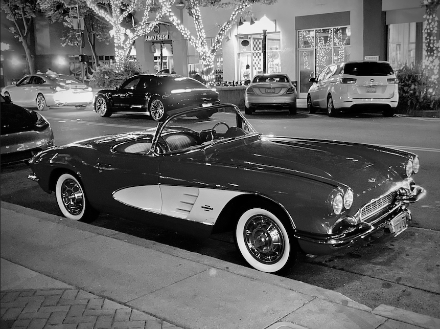 CLASSIC CORVETTE — A 1961 Corvette Convertible sits parked among the sea of newer cars in downtown Palo Alto. Photo by Gopala Varadarajan.
