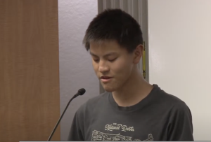STUDIOUS STUDENT — Sophomore Miles Hua speaks at the recent May 9th board meeting about the exclusion of Multivariable Calculus from dual enrollment credits. Hua was unable to take Multivariable Calculus this year because he did not make it off the waitlist. This year, he hopes he will be able to take the class, and is excited with the direction of changes to the class. “Its good that they are finally starting to make changes after resisting for so long,” Hua said. “I think the last board meeting did have a good effect on Don Austin and the rest of the [school] board.” Photo: Courtesy of Palo Alto Unified School District Board of Education