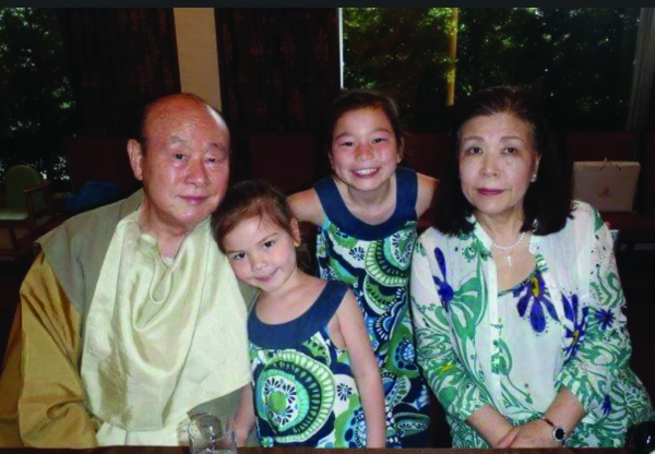 FAMILY TIES — My sister, my grandparents and I pose for a photo at my grandfathers birthday dinner in Tokyo. This photo was taken 13 years ago, when I lived there. Now that I live in Palo Alto, I only see my grandparents once a year.