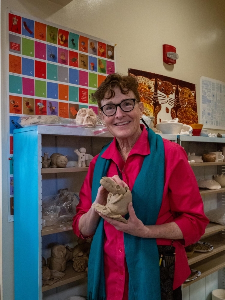 DYNAMIC CERAMICS — Tree Munoz, Paly’s new Fiery Arts teacher, holds one of many free-form clay sculptures made by her students. “People are unique,” Munoz said. “They all want something different, and in art, you get to do that.”