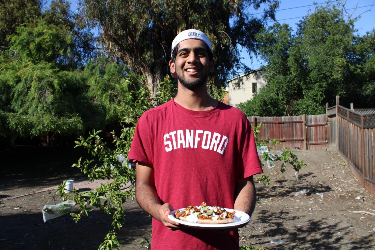 DISH ON DISPLAY — Shashi holds up a freshly made plate of chicken shawarma. “His meals are the perfect price for such high quality, great tasting food,” Paly freshman Justin Fung said.