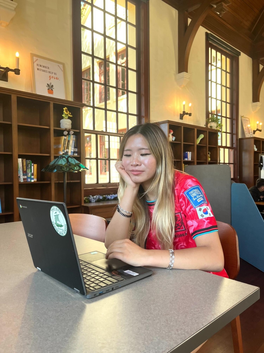 Serene Study Space — In the Tower Learning Center, Paly junior Ellie Yi finishes up work for her classes. “It [the center] is so relaxing,” Yi said. “I TA there and I like the ambience.”