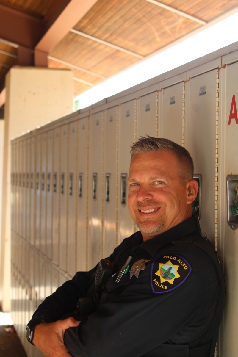 GUIDING DECISIONS —
Officer Brian Connelly smiles while leaning on the lockers at Palo Alto High School on a Friday afternoon. He recently visited to talk about making better choices and resisting peer pressure. “One bad decision really leads to more bad decisions,” Connelly said. 