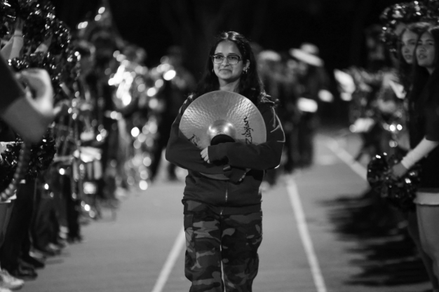 BYE BAND — Palo Alto High School senior Naila Ahmed walks down the track.