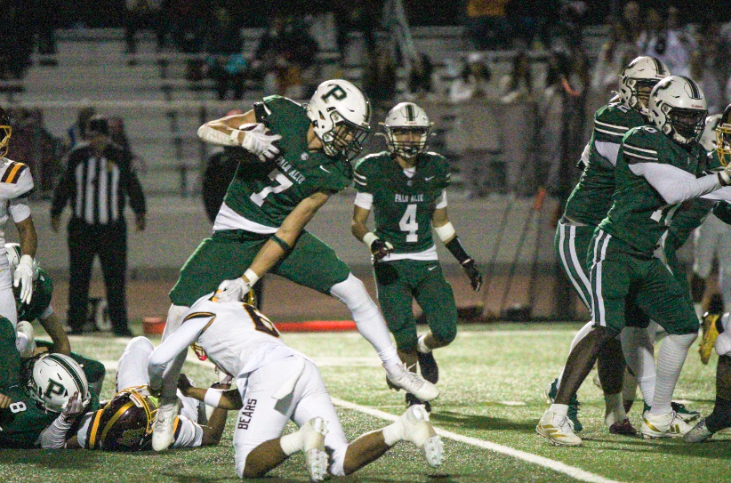 VAULTING VIKING — Palo Alto High School junior and wide receiver Clement Romanski hurdles over an opposing player while running the ball.