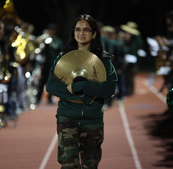 BYE BAND — Palo Alto High School senior Naila Ahmed walks down the track.