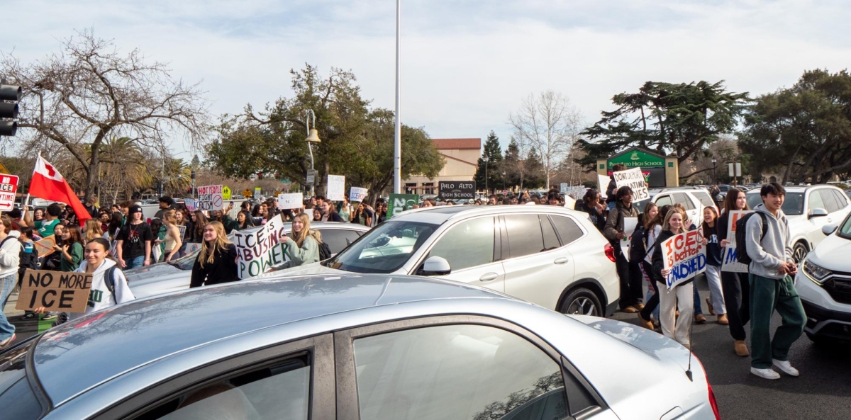 SEA OF STUDENTS— Protesters swarm around cars in the streets and sidewalks. “We’re making sure our community knows that we are immigrants, we stand with immigrants, and we will not stop standing up for them,” Paly junior Leilani said. 