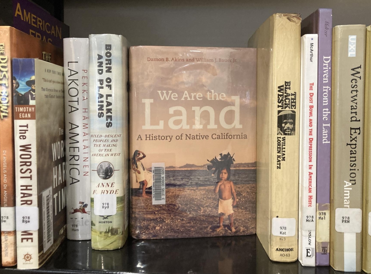 "We Are the Land: A History of Native California" by Damon B. Akins and William J. Bauer Jr. perches in the Native American history section of the Paly library. Told from the perspective of Indigenous Californians, the text is one of the nine at Redwood National Park facing a potential ban. "It's part of the history of this land, the identity of the park and why we go to these parks," Paly librarian Sima Thomas said.